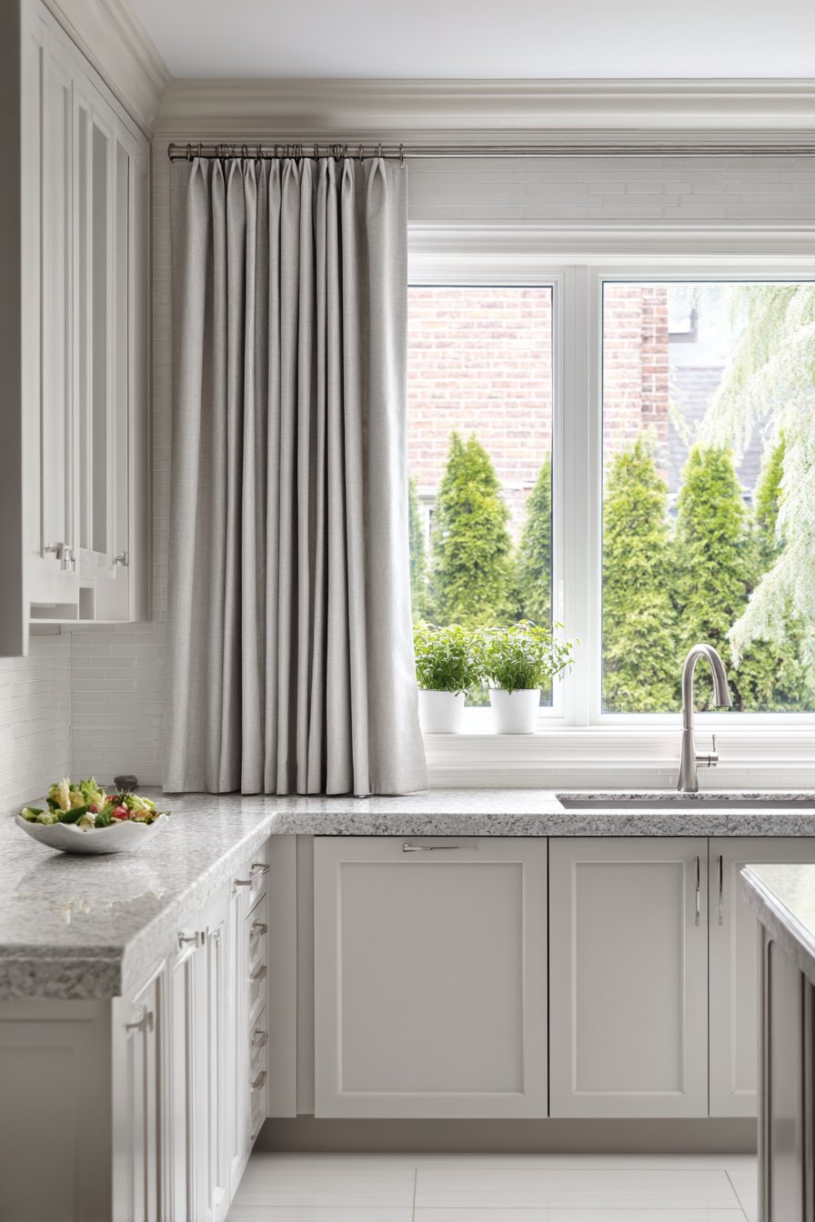 Grey Kitchen with Elegant Window Treatments