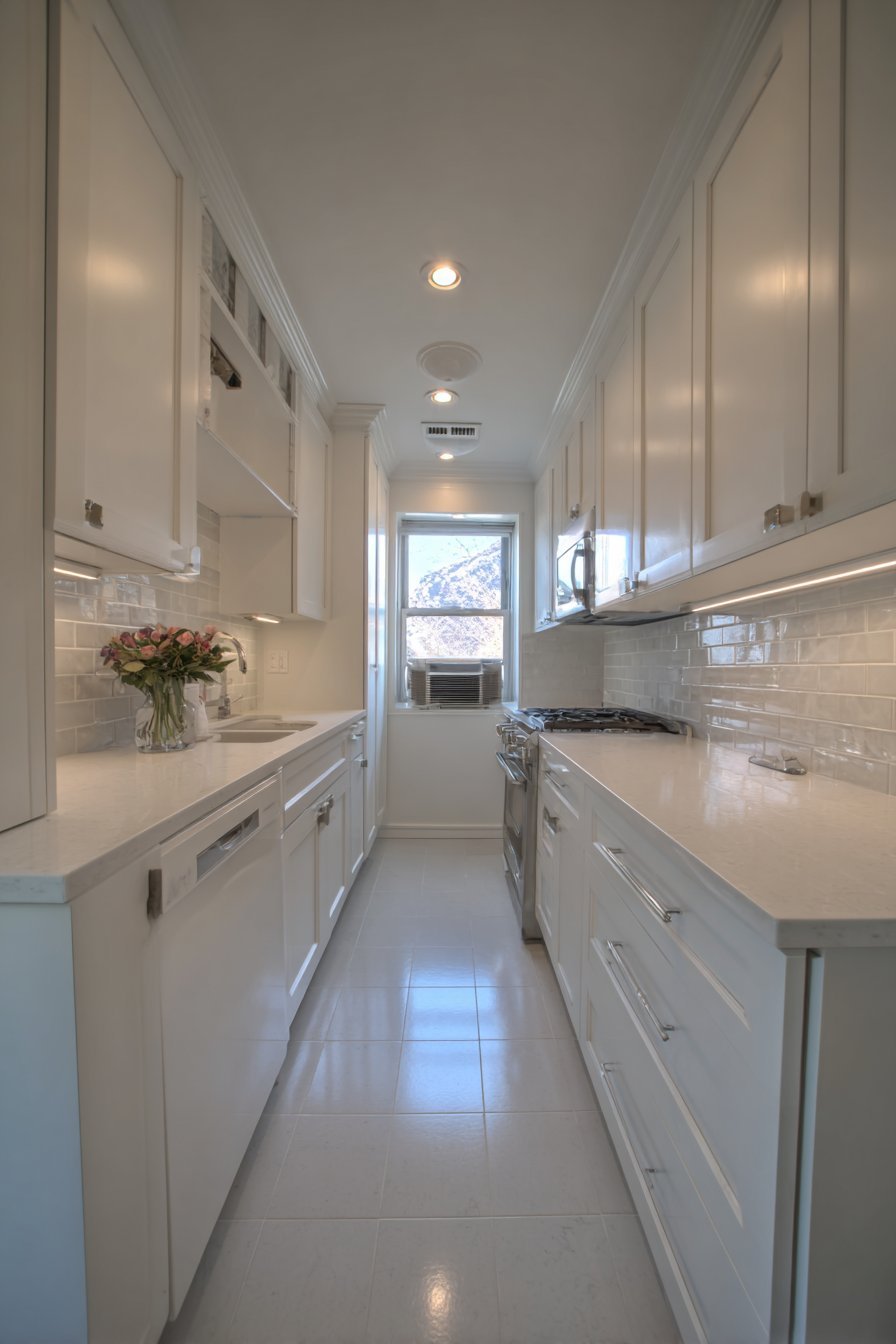 Compact U-Shaped White Kitchen