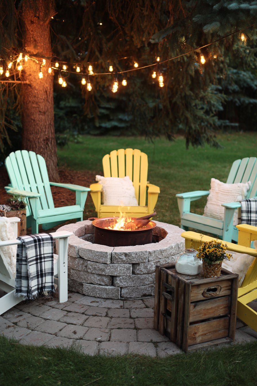 Circular Fire Pit with Colorful Adirondack Chairs