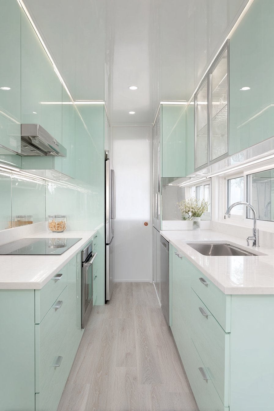 Space-Maximizing Pistachio Galley Kitchen