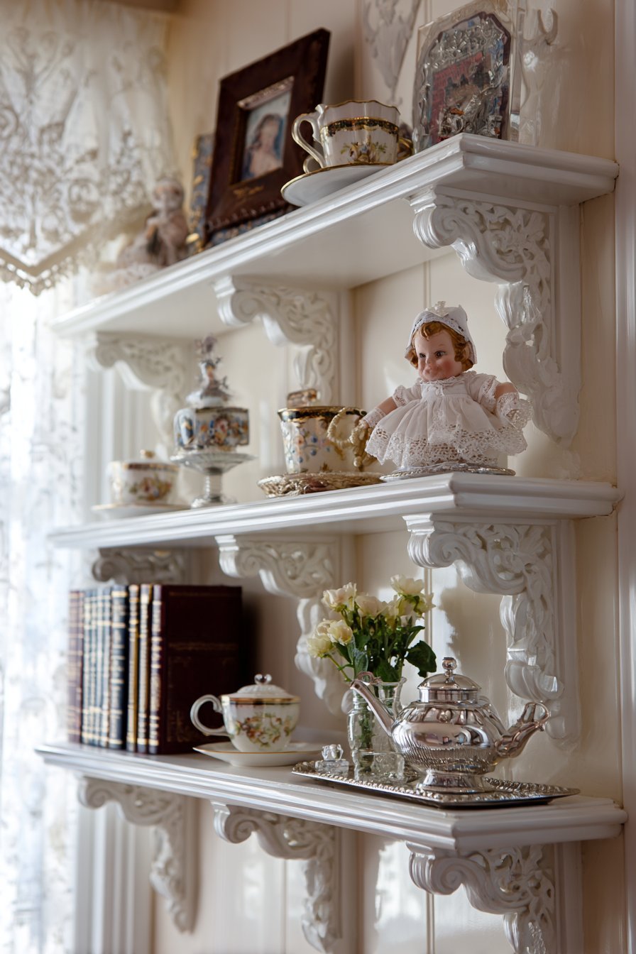 Traditional White Painted Shelves with Ornate Details